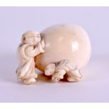 A MID 19TH CENTURY JAPANESE MEIJI PERIOD CARVED IVORY NETSUKE modelled as a male resting against a