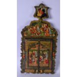 A MID 20TH CENTURY PERSIAN LAQUERED MIRROR, painted with figures in various pursuits. 59 cm x 30