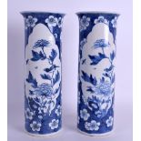A PAIR OF 19TH CENTURY CHINESE BLUE AND WHITE SPILL VASES bearing Kangxi marks to base, painted with