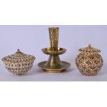 A 19TH CENTURY ISLAMIC BRONZE CANDLESTICK, together with two carved ivory boxes highlighted with