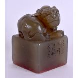 AN EARLY 20TH CENTURY CHINESE CARVED GREEN JADE SEAL decorated with calligraphy and formed with a