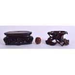 TWO 19TH CENTURY CHINESE CARVED HARDWOOD STANDS of small proportions, together with a jewelled ojime