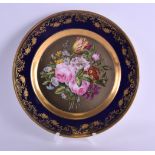 AN EARLY 19TH CENTURY CHAMBERLAINS WORCESTER CABINET PLATE painted with a bold floral spray within a