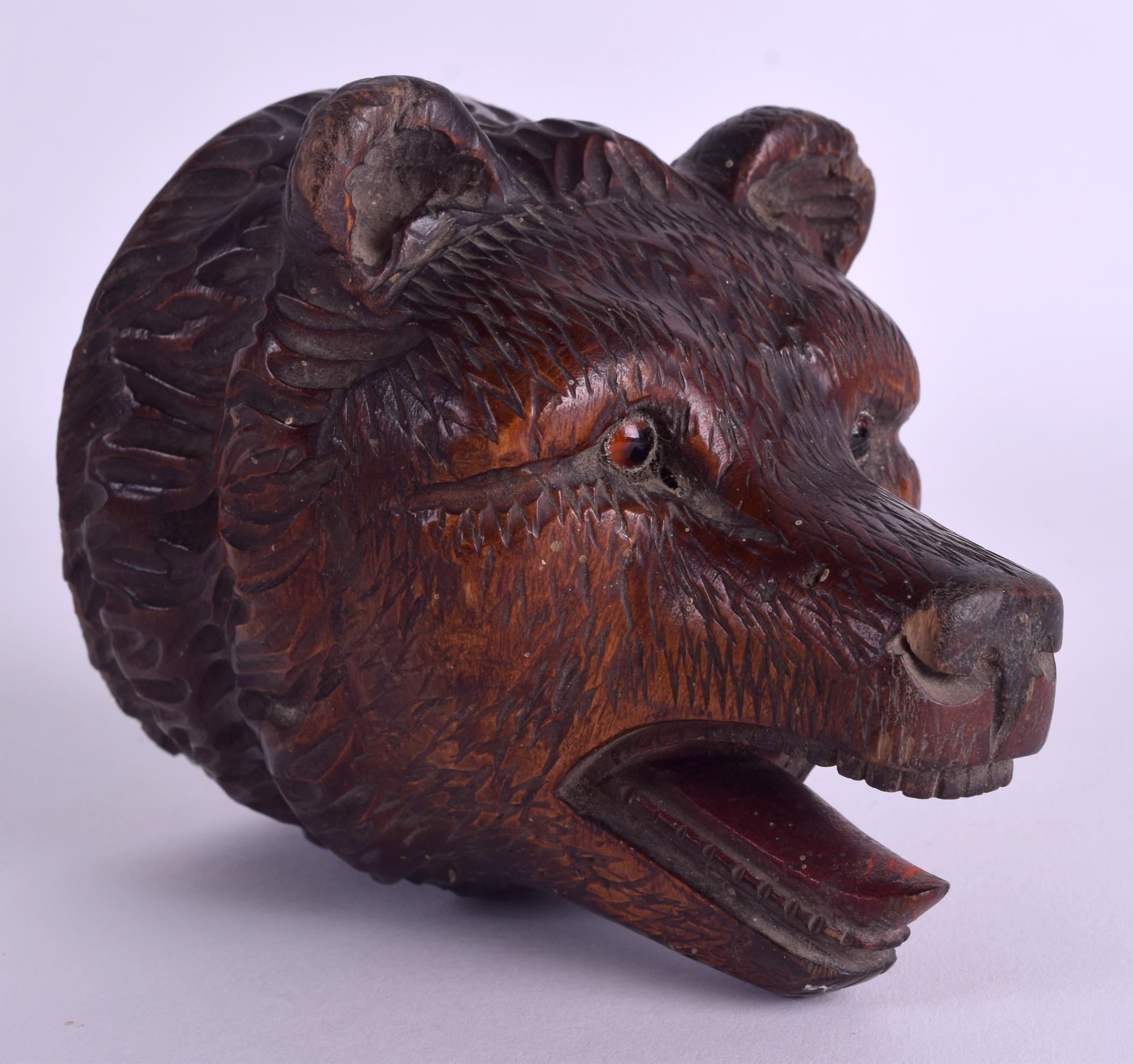 A LATE 19TH CENTURY BAVARIAN BLACK FOREST CARVED BEAR WALL PLAQUE possibly a pocket watch hanging