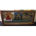 A VINTAGE PUB ADVERTISING MIRROR, depicting Bass On Draught. 37 cm x 81 cm.