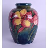 A WILLIAM MOORCROFT POTTERY VASE painted with floral sprays. 15.5 cm high.
