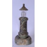 A 20TH CENTURY CARVED STONE LIGHTHOUSE, converted into a lamp. 22 cm high.