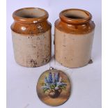 A PAIR OF EARLY 20TH CENTURY STONEWARE POTS, together with an oil on panel, study of flowers in a
