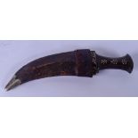 AN EARLY 20TH CENTURY RHINOCEROS HORN HANDLED JAMBIYA DAGGER, inlaid with studwork and etched blade.