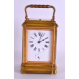 A 19TH CENTURY FRENCH BRASS REPEATING ALARM CARRIAGE CLOCK with white enamel dial painted with black
