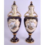 A LARGE PAIR OF EARLY 20TH CENTURY COALPORT VASES AND COVERS painted with Scottish Loch scenes by
