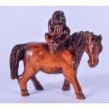 AN EARLY 20TH CENTURY WOODEN NETSUKE, carved in the form of a monkey on the back of a horse. 6 cm