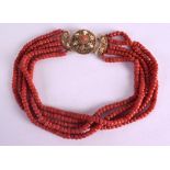 AN 18CT GOLD AND RED CORAL NECKLACE with openwork clasp. 125 grams. 41 cm long.