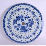 AN 18TH CENTURY EXPORT BLUE AND WHITE PORCELAIN STRAINING DISH Qianlong, painted with floral sprays.