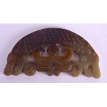 AN EARLY 20TH CENTURY CHINESE CARVED MUTTON JADE PLAQUE Sung style, formed with opposing animal mask