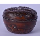 A SET OF THREE CHINESE BRONZE GRADUATED STACKING BOWLS, decorated in relief with dragons. Largest
