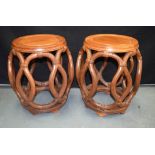 A PAIR OF EARLY 20TH CENTURY CHINESE CARVED HARDWOOD BARREL SEATS Qing/Republic, of openwork form