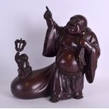 A 19TH CENTURY CHINESE BRONZE FIGURE OF A BUDDHA modelled with a child resting upon his bulging
