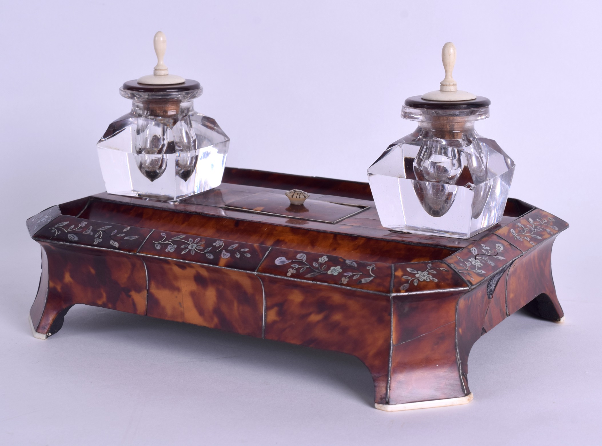 AN EARLY 19TH CENTURY REGENCY TORTOISESHELL AND MOTHER OF PEARL DESK STAND decorated with