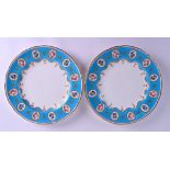 A CHARMING PAIR OF MINTON PORCELAIN PLATES painted with flowers upon a delicate turquoise border. 23