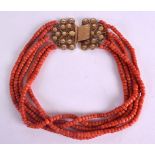 AN 18CT GOLD AND RED CORAL NECKLACE with foliate clasp. 116 grams. 41 cm long.