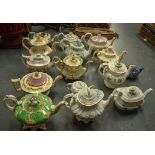 A COLLECTION OF FIFTEEN ENGLISH TEA POTS AND COVERS, of varying factory. (15)
