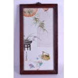 A CHINESE FAMILLE ROSE PORCELAIN PLAQUE 20th Century, painted with hanging vines and objects. 15