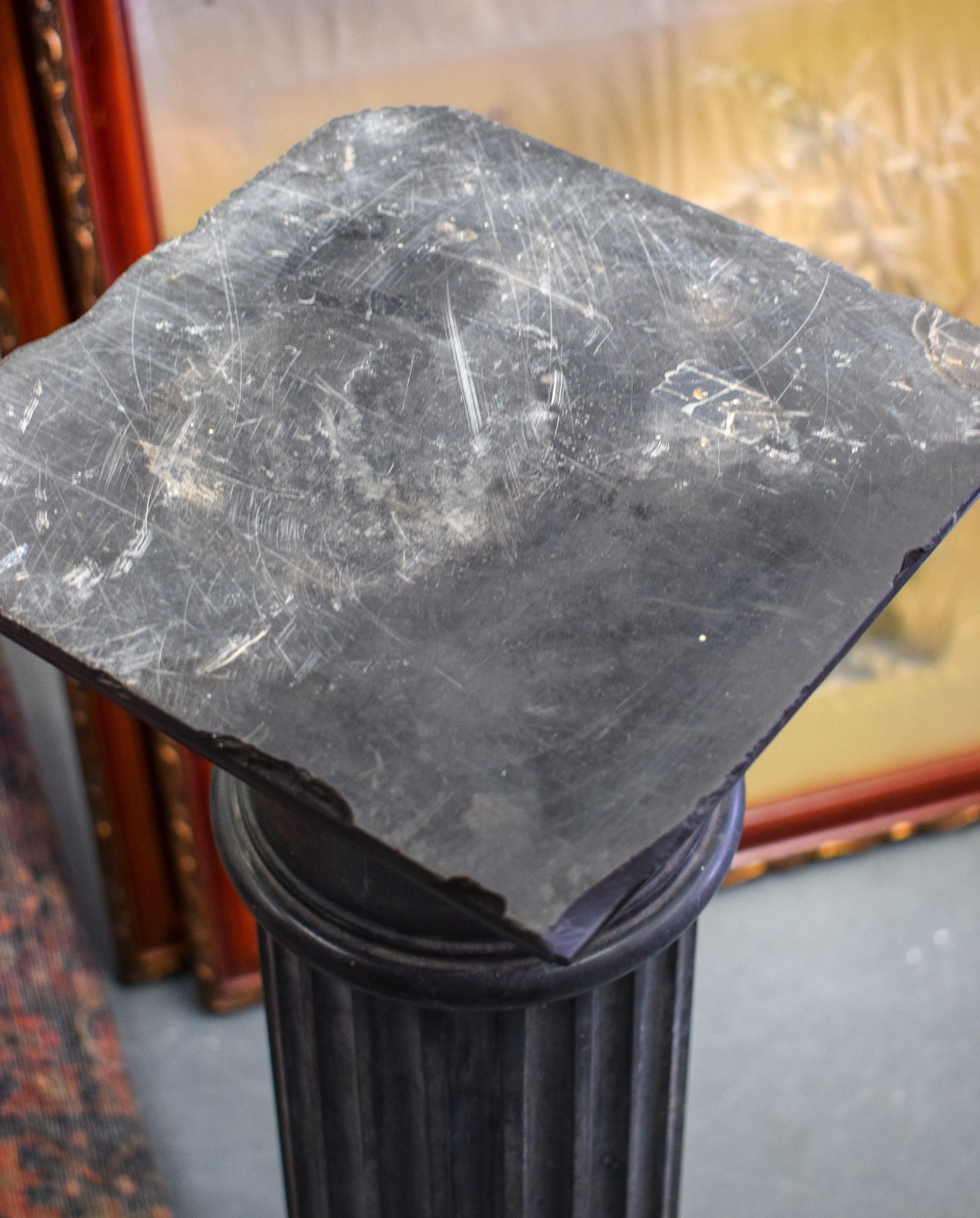 AN EARLY 20TH CENTURY SLATE CORINTHIAN COLUMN, formed on a stepped pedestal base. 81 cm high. - Image 2 of 3