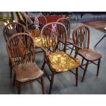 A SET OF SIX OAK WINDSOR BACK CHAIRS, two carvers. Carvers 97 cm high.