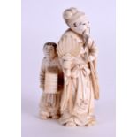 A 19TH CENTURY JAPANESE MEIJI PERIOD CARVED IVORY OKIMONO modelled as a male holding a fan beside