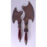 TWO EARLY 19TH CENTURY CARVED WOOD AND IRON BATTLE AXES. 55 cm & 42 cm long. (2)