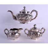 A LATE 19TH CENTURY CHINESE EXPORT THREE PIECE SILVER TEASET decorated with dragons. 860 grams.