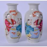 A PAIR OF 20TH CENTURY CHINESE PORCELAIN VASES, decorated with two boys playing with bats. 12.5 cm