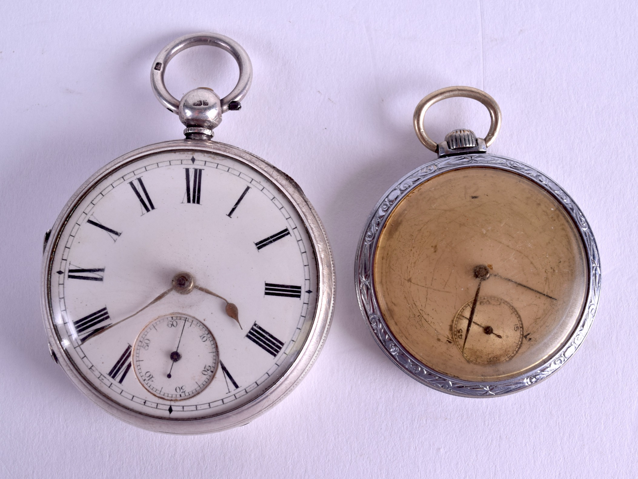 A 19TH CENTURY ENGLISH SILVER POCKET WATCH together with another white metal watch. 5.25 cm & 4 cm