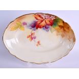 A ROYAL WORCESTER OVAL DISH painted with autumnal leaves and berries by Kitty Blake. 27 cm wide.