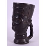 A RARE EARLY 20TH CENTURY AFRICAN TRIBAL HARDWOOD CUP possibly Luba, with incised features. 24 cm