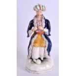 A LARGE MID 19TH CENTURY STAFFORDSHIRE FIGURE OF A TURK modelled in rich blue robes upon a shaped