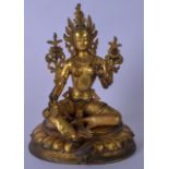 A 20TH CENTURY CHINESE GILT BRONZE BUDDHA, formed seated with one hand raised. 29 cm high.