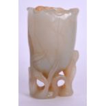 AN EARLY 20TH CENTURY CHINESE CARVED JADE LOTUS VASE Qing, of naturalistic form. 8.5 cm x 4 cm.