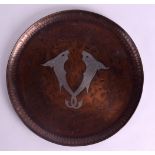 AN ARTS AND CRAFTS NEWLYN STYLE COPPER AND SILVER DISH decorated with fish. 27 cm diameter.
