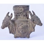AN 18TH/19TH CENTURY INDIAN BRONZE CENSER, formed with three mask head handles. 9 cm high.