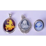 A SILVER MOUNTED CAMEO RING DEPICTING A FEMALE, together with two similar pendants. Largest 5 cm.