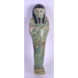 AN EGYPTIAN FAIENCE GLAZED SHABTI FIGURE possibly Late Period, with black decorated hair and