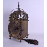 A BRASS LANTERN CLOCK by Thomas Moore of Ipswich, decorated with open work foliage. 37 cm x 15 cm.