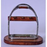 AN UNUSUAL HERMES LEATHER AND CHOME STAND, possibly made from a stirrup. 16 cm high.