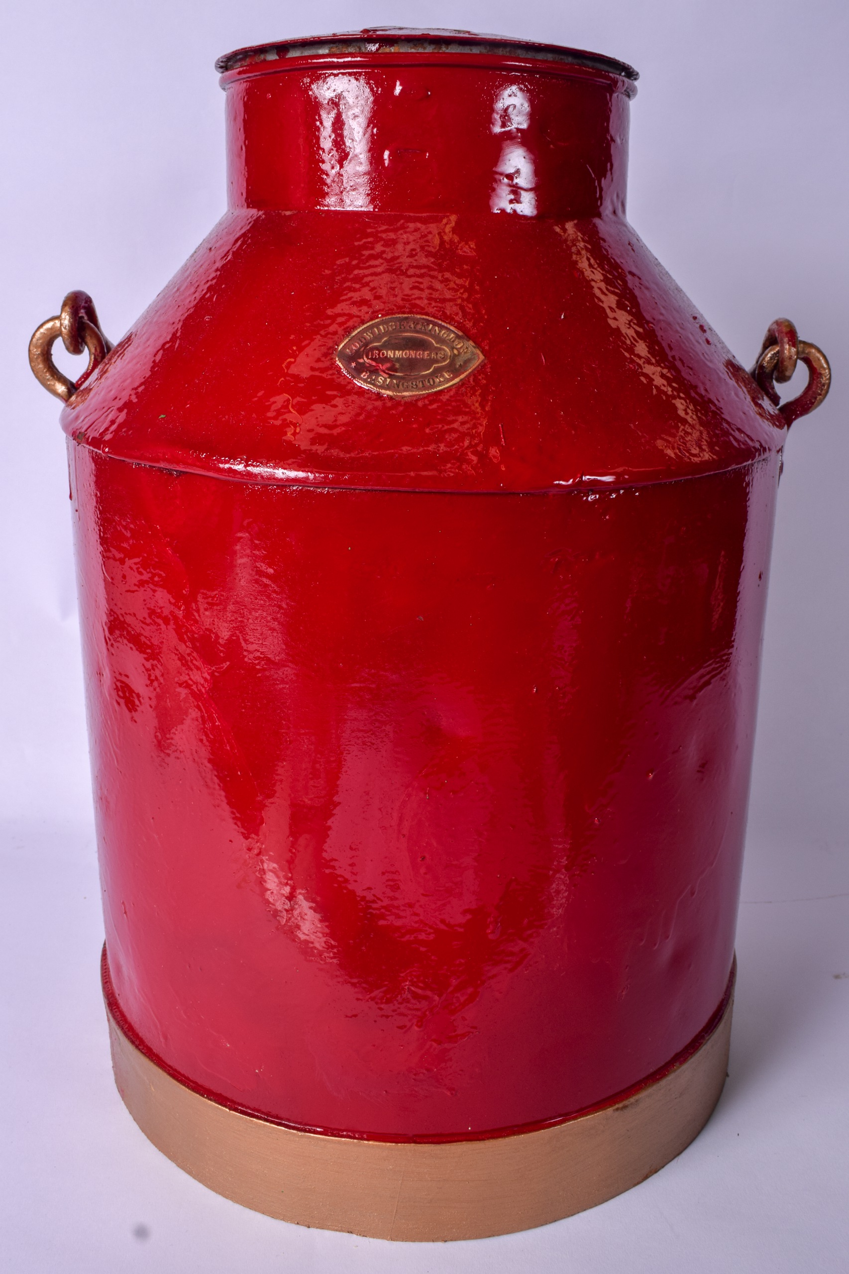 A VINTAGE MILK CHURN OR PAIL PAINTED RED, by "Lodwidge & Kingdon Ironmongers, Basingstoke. 45 cm
