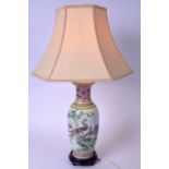 A CHINESE FAMILLE ROSE PORCELAIN VASE CONVERTED TO A LAMP, decorated with exotic birds and a panel