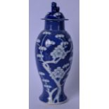 A 20TH CENTURY CHINESE BLUE AND WHITE PORCELAIN VASE AND COVER, decorated with prunus and the finial