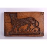 A CHARMING 18TH/19TH CENTURY CONTINENTAL TREEN PRESS MOULD modelled as a tiger within a landscape.