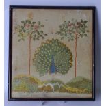 A FRAMED VICTORIAN EMBROIDERY, depicting a peacock in a landscape. 30 cm x 26.5 cm.